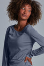 ONNO long sleeve bamboo t-shirt in Stone, Sage is 5'7" and wearing size XS.