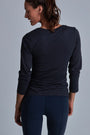 ONNO long sleeve bamboo t-shirt in Charcoal Blue, Christina is 5'9" and wearing size S.