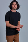 ONNO hemp t-shirt in Black Unpatched, Nic is 5'11" and wearing size M.