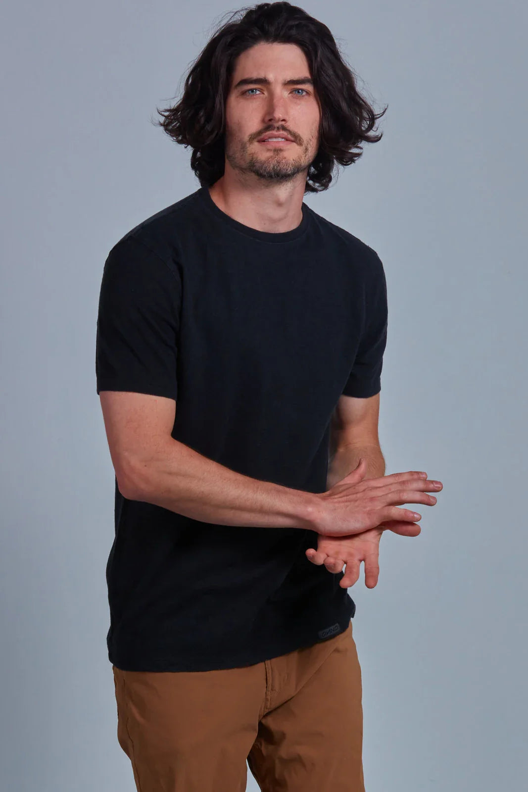 ONNO hemp t-shirt in Black Unpatched, Nic is 5'11" and wearing size M.