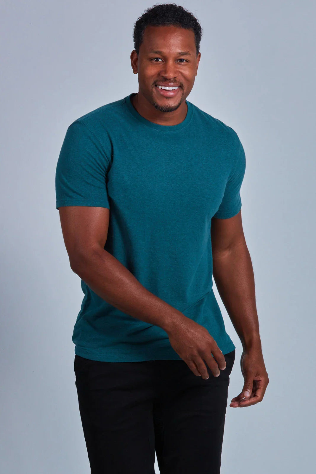 ONNO hemp t-shirt in Teal Unpatched, Golden is 6'0" and wearing size L.