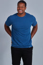 ONNO hemp t-shirt in Earth Blue Unpatched, Golden is 6'0" and wearing size L.