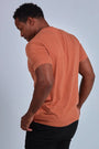 ONNO hemp t-shirt in Rust, Golden is 6'0" and wearing size L.