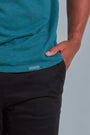 ONNO hemp t-shirt in Teal, Golden is 6'0" and wearing size L.