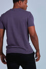 ONNO hemp t-shirt in Dirty Purple, Golden is 6'0" and wearing size L.