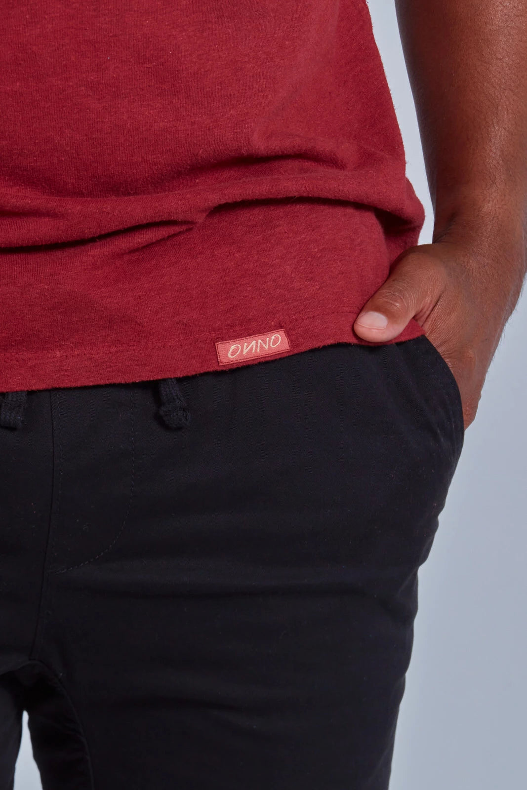 ONNO hemp t-shirt in Cardinal, Golden is 6'0" and wearing size L.