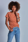 ONNO hemp t-shirt in Rust Unpatched, Sage is 5'7" and wearing size XS.