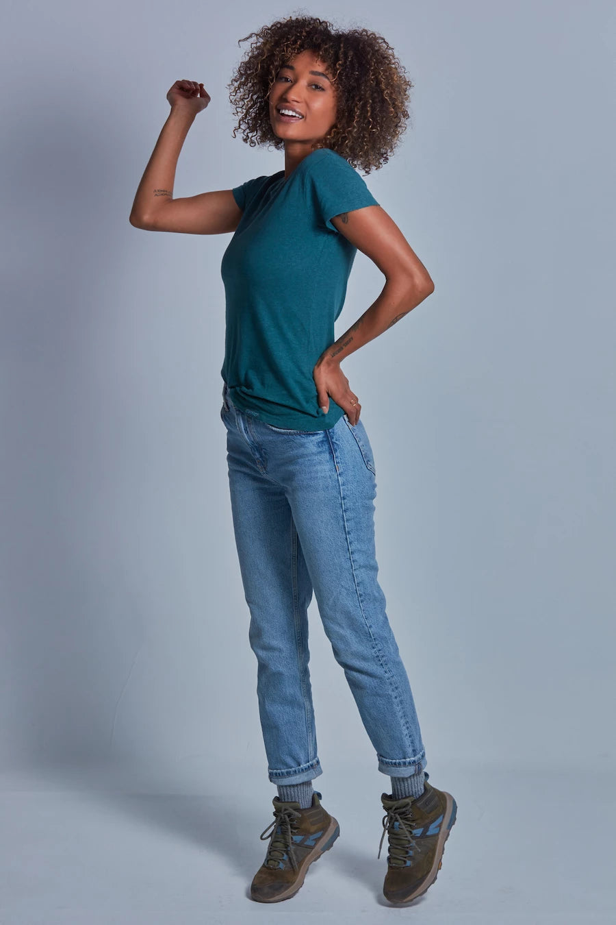 ONNO hemp t-shirt in Teal, Sage is 5'7" and wearing size XS.
