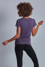 ONNO hemp t-shirt in Dirty Purple, Sage is 5'7" and wearing size XS.