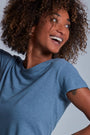 ONNO hemp t-shirt in Steel Blue, Sage is 5'7" and wearing size XS.