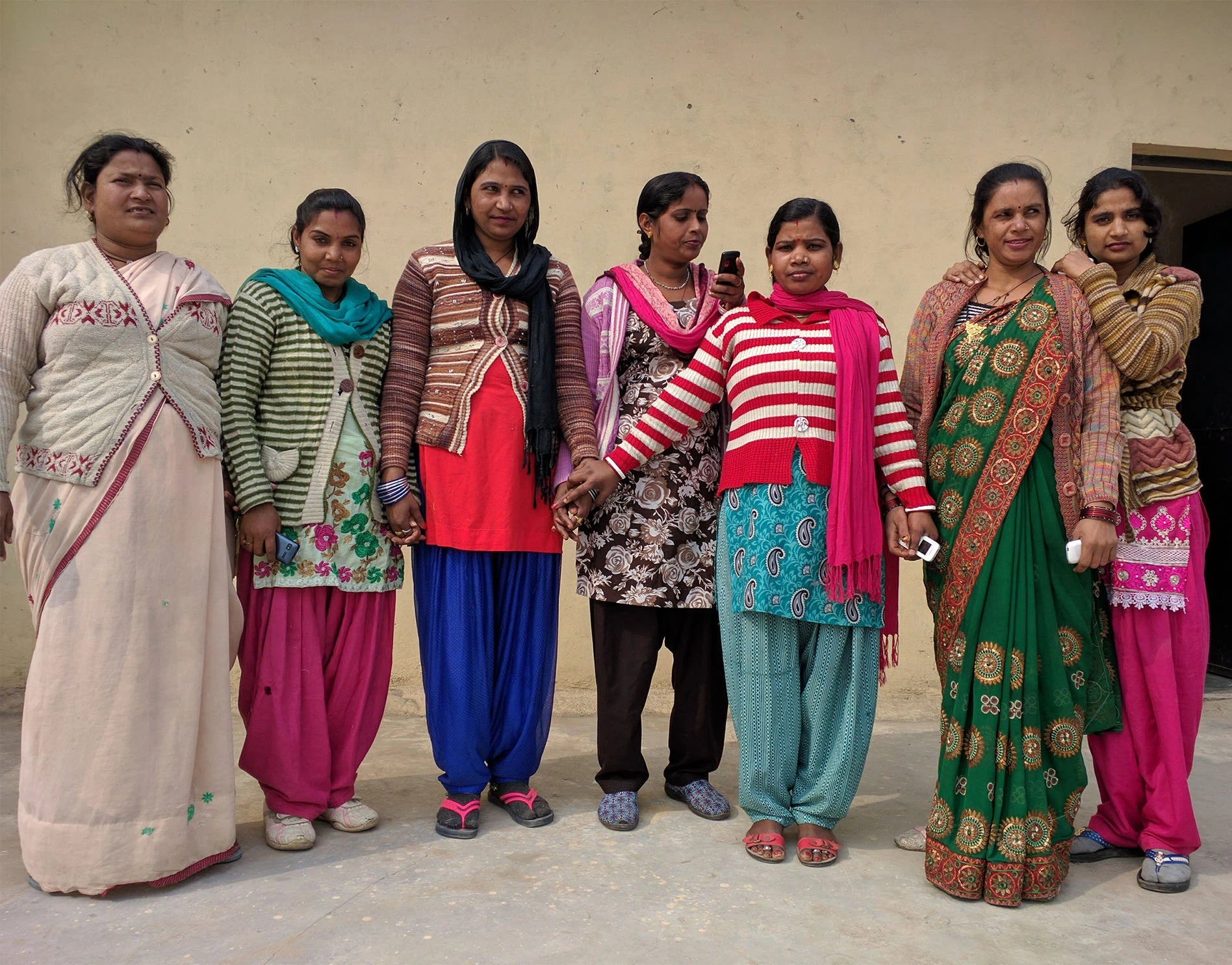 7 Indian women pose for a group photo