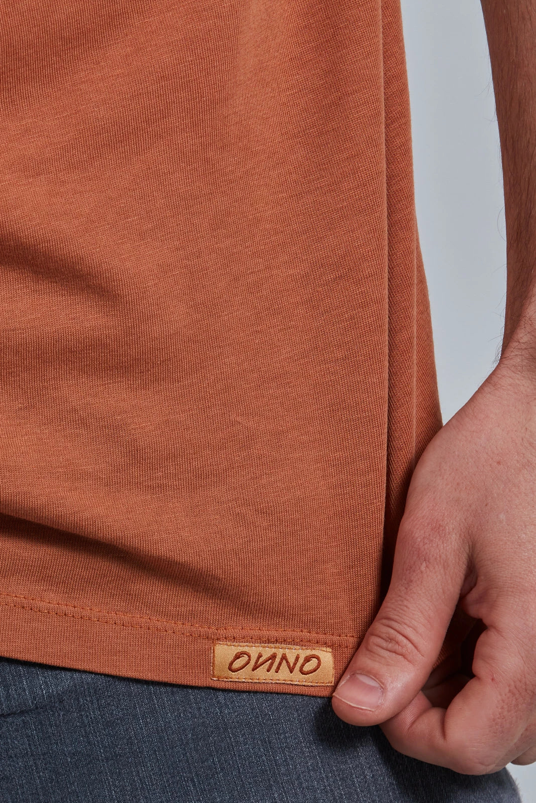 ONNO lyocell bamboo t-shirt in Rust, Nic is 5'11" and wearing size M.