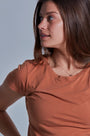 ONNO beechwood t-shirt in Rust, Caroline is 5'8" and wearing size S.