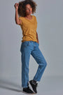 ONNO beechwood t-shirt in Mustard, Sage is 5'7" and wearing size XS.