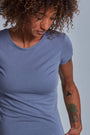 ONNO beechwood t-shirt in Stone, Sage is 5'7" and wearing size XS.