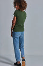 ONNO beechwood t-shirt in Moss Green, Sage is 5'7" and wearing size XS.
