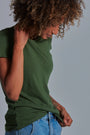 ONNO beechwood t-shirt in Moss Green, Sage is 5'7" and wearing size XS.