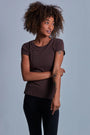 ONNO beechwood t-shirt in Espresso, Sage is 5'7" and wearing size XS.