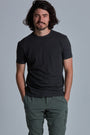 ONNO organic cotton t-shirt in Heathered Basalt Unpatched, Nic is 5'11" and wearing size M.