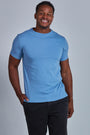 ONNO organic cotton t-shirt in Azure Blue Unpatched, Golden is 6'0" and wearing size L.