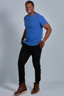ONNO organic cotton t-shirt in Blue Ink Unpatched, Golden is 6'0" and wearing size L.