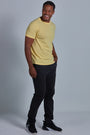 ONNO organic cotton t-shirt in Yellow Unpatched, Golden is 6'0" and wearing size L.