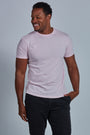ONNO organic cotton t-shirt in Pink Unpatched, Golden is 6'0" and wearing size L.