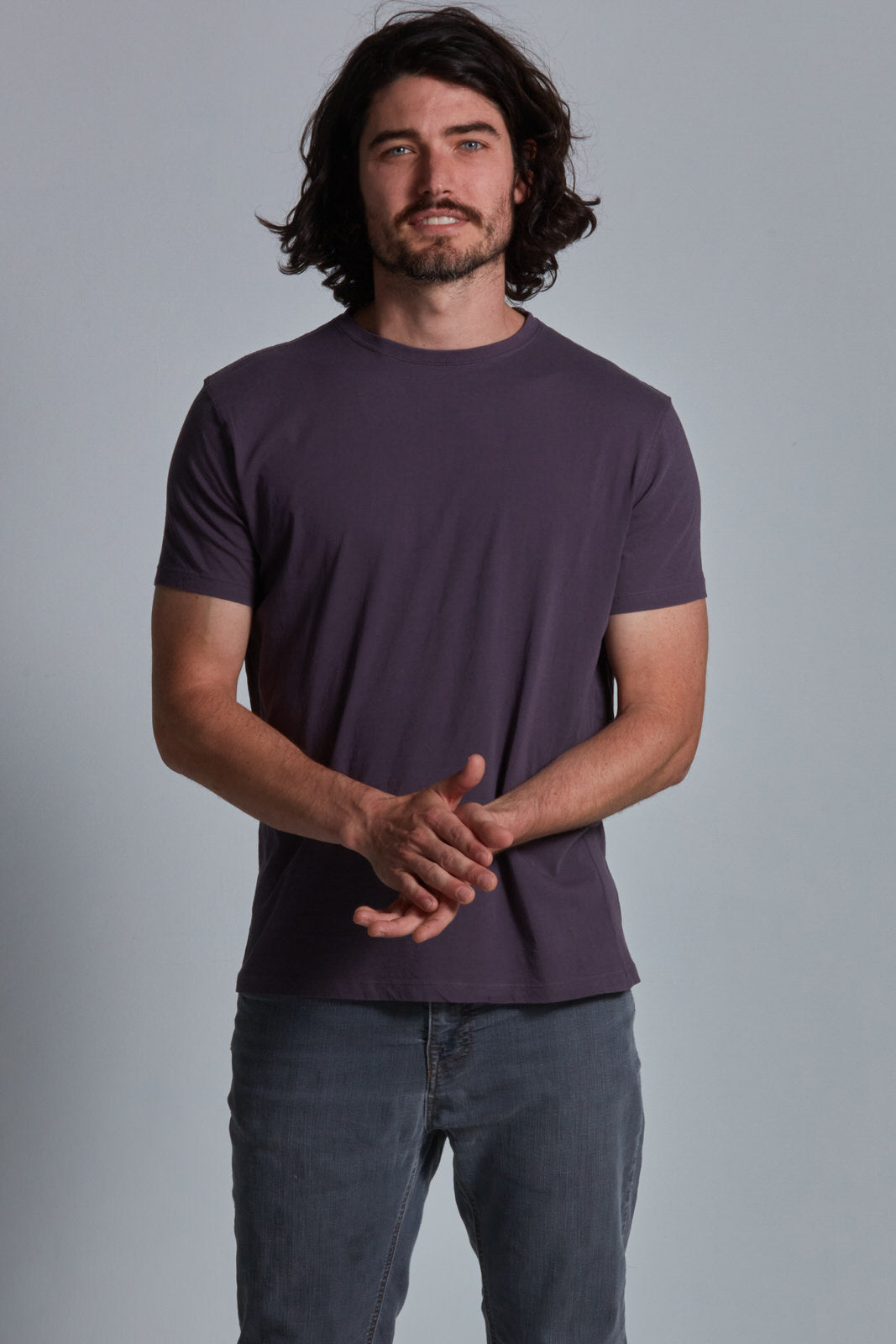 ONNO organic cotton t-shirt in Dirty Purple Unpatched, Nic is 5'11" and wearing size M.