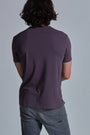 ONNO organic cotton t-shirt in Dirty Purple Unpatched, Nic is 5'11" and wearing size M.