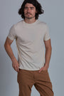 ONNO organic cotton t-shirt in Natural Unpatched, Nic is 5'11" and wearing size M.