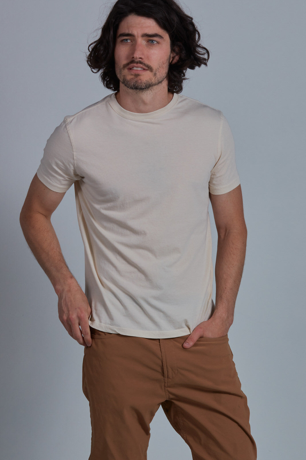 ONNO organic cotton t-shirt in Natural Unpatched, Nic is 5'11" and wearing size M.