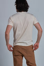 ONNO organic cotton t-shirt in Natural Unpatched, Nic is 5'11" and wearing size M.