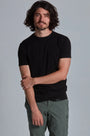 ONNO organic cotton t-shirt in Black, Nic is 5'11" and wearing size M.