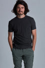 ONNO organic cotton t-shirt in Heathered Basalt, Nic is 5'11" and wearing size M.