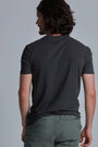 ONNO organic cotton t-shirt in Heathered Basalt, Nic is 5'11" and wearing size M.