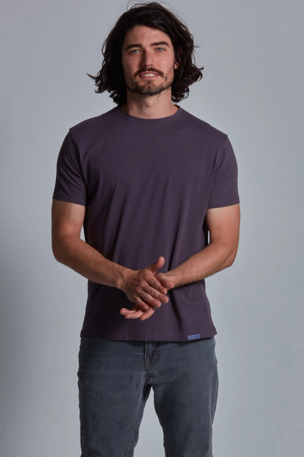 ONNO organic cotton t-shirt in Dirty Purple, Nic is 5'11" and wearing size M.