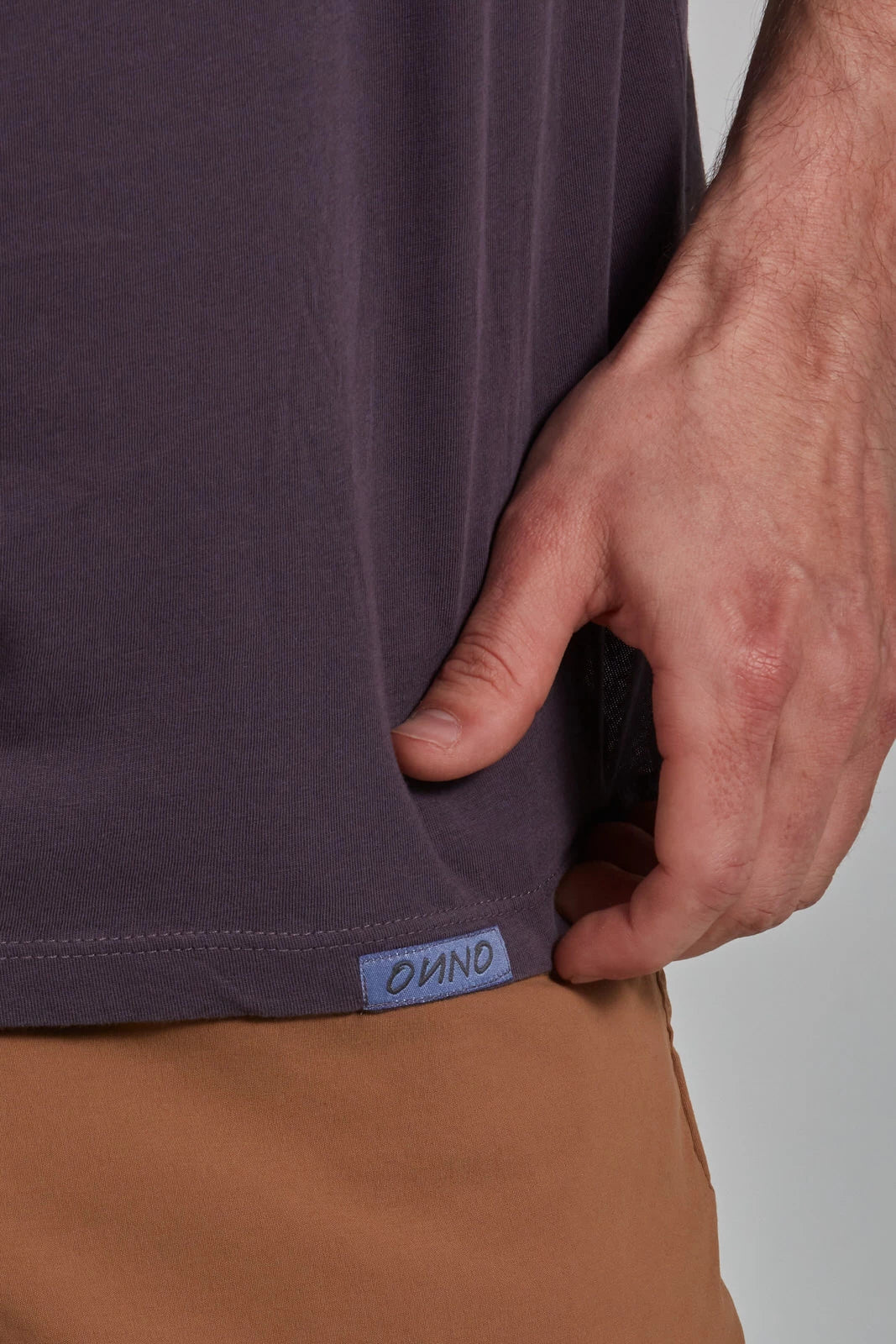 ONNO organic cotton t-shirt in Dirty Purple, Nic is 5'11" and wearing size M.