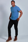 ONNO organic cotton t-shirt in Sea Blue, Golden is 6'0" and wearing size L.