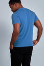 ONNO organic cotton t-shirt in Sea Blue, Golden is 6'0" and wearing size L.