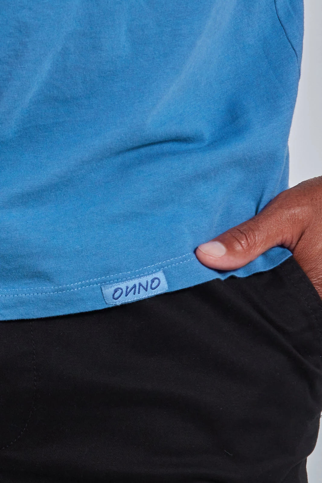 ONNO organic cotton t-shirt in Sea Blue, Golden is 6'0" and wearing size L.