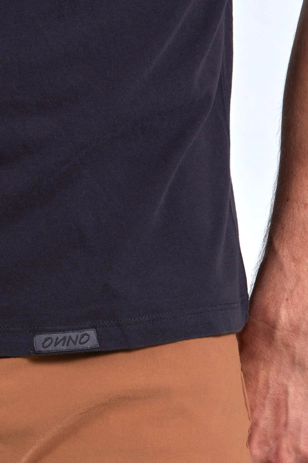 ONNO organic cotton t-shirt in Charcoal Blue, Nic is 5'11" and wearing size M.