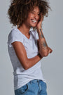 ONNO organic cotton t-shirt in White, Sage is 5'7" and wearing size XS.