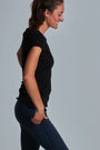ONNO organic cotton t-shirt in Black, Christina is 5'9" and wearing size S.