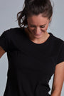 ONNO organic cotton t-shirt in Black, Christina is 5'9" and wearing size S.