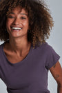 ONNO organic cotton t-shirt in Dirty Purple, Sage is 5'7" and wearing size XS.