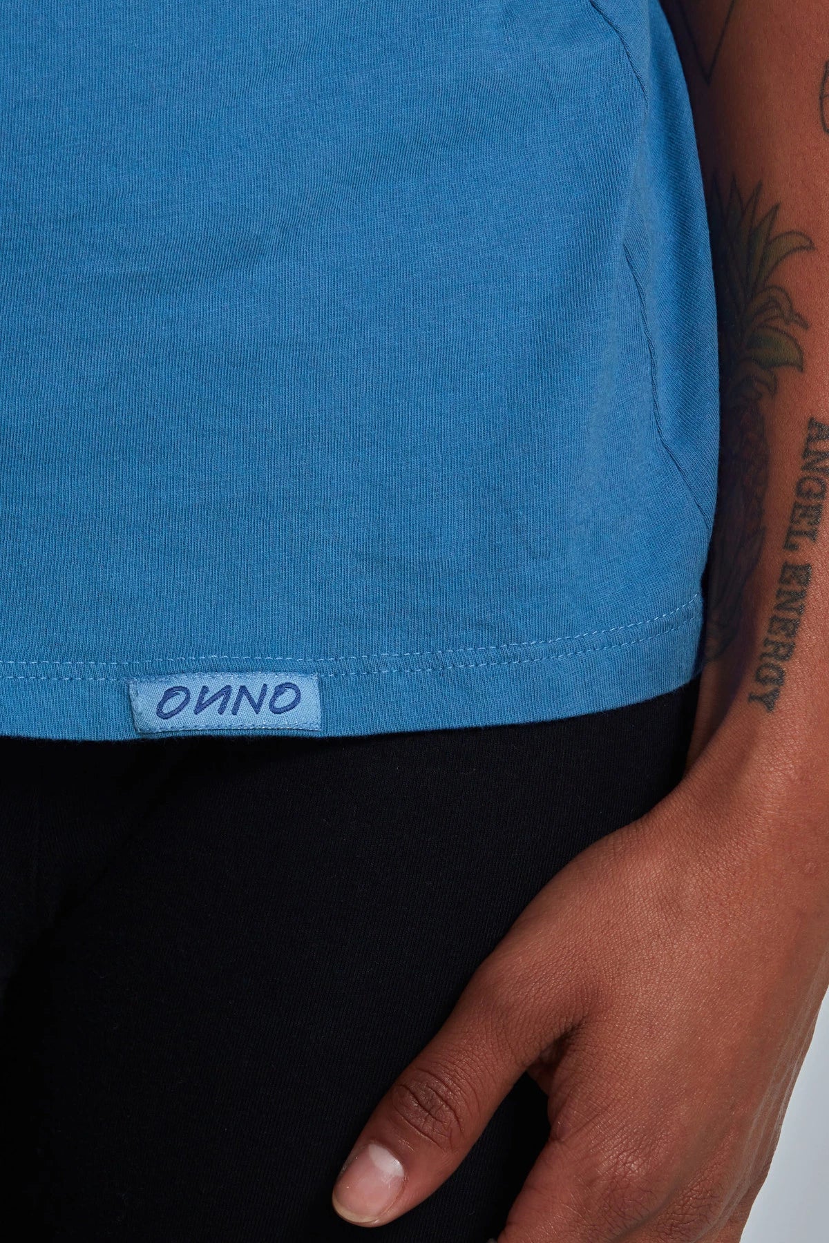 ONNO organic cotton t-shirt in Sea Blue, Sage is 5'7" and wearing size XS.