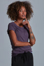 ONNO pima cotton t-shirt in Dirty Purple, Sage is 5'7" and wearing size XS.